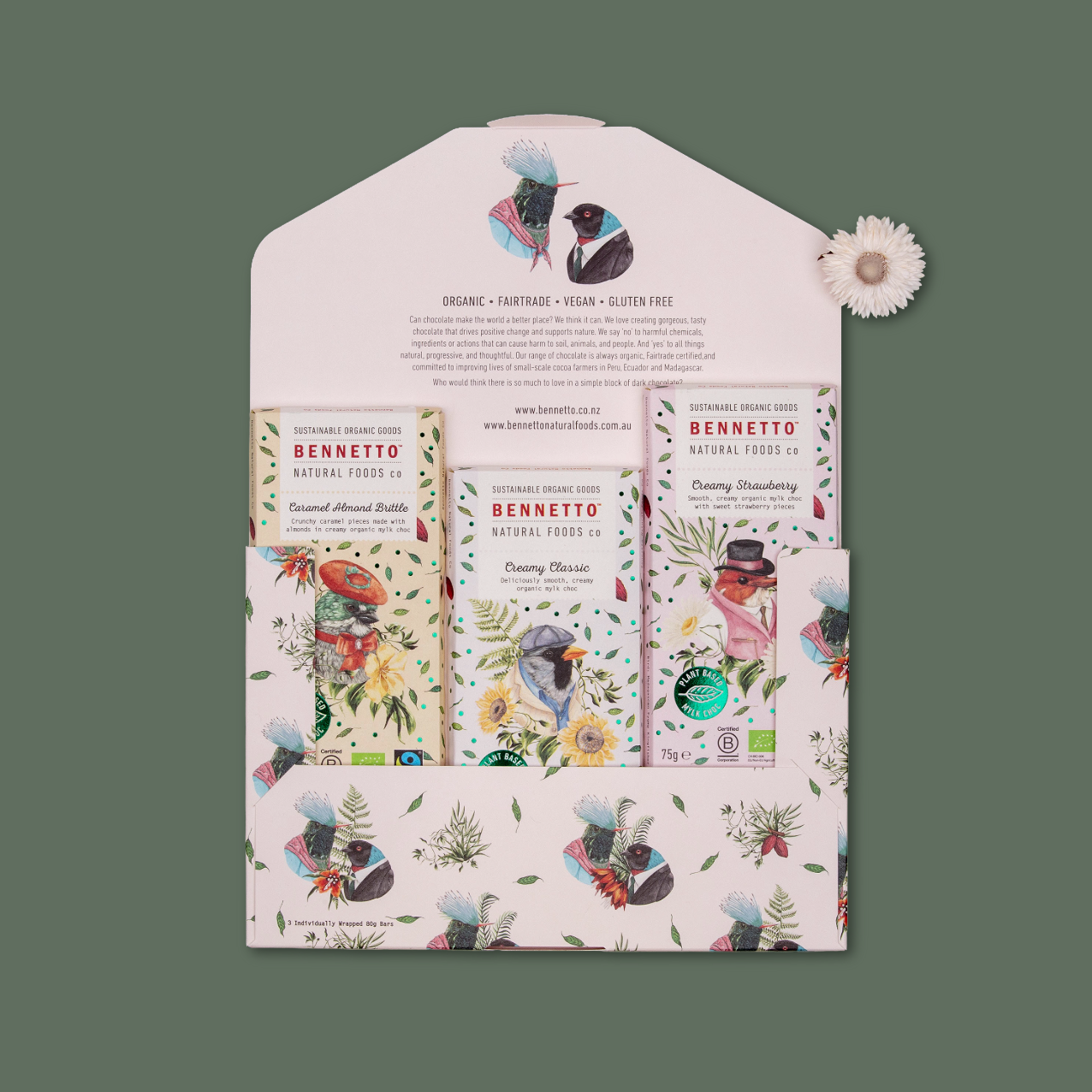 A Bennetto-themed envelope featuring three Bennetto creamy mylk chocolate bars, arranged on a muted green background.